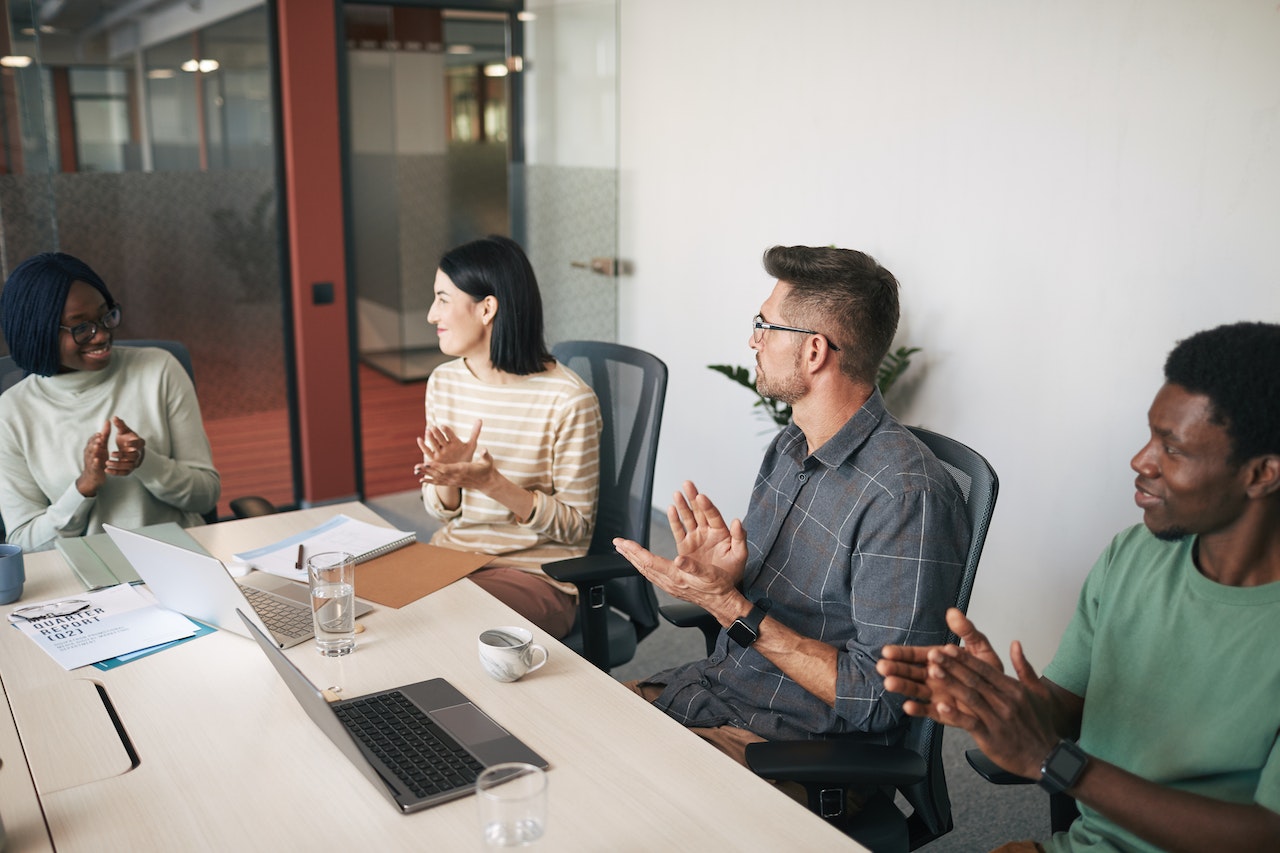 A Group of People Clapping Hands in the Office