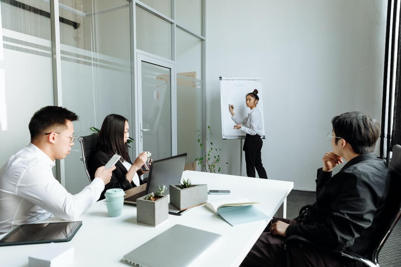 A Group of People Having a Meeting in the Office