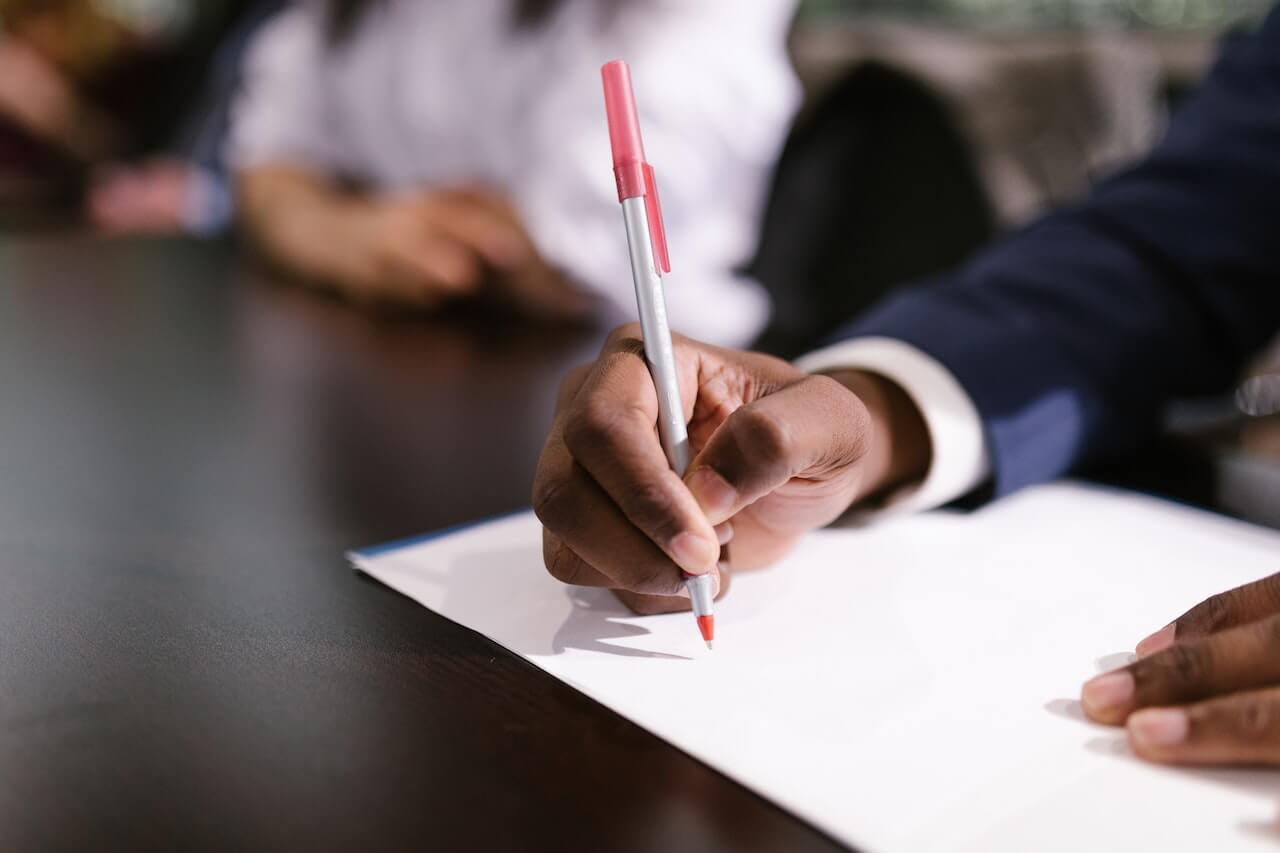 A Person Holding a Pen