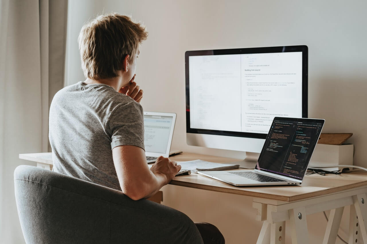 A-blogger-working-with-a-desktop-in-his-apartment