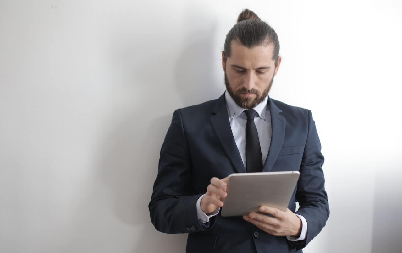 A-business-man-going-pressing-his-tablet.