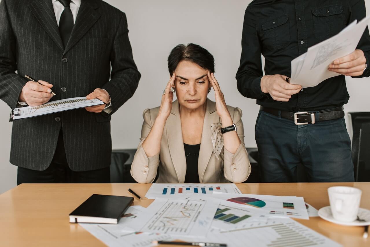 A-female-stressed-during-a-meeting-on-crisis-management