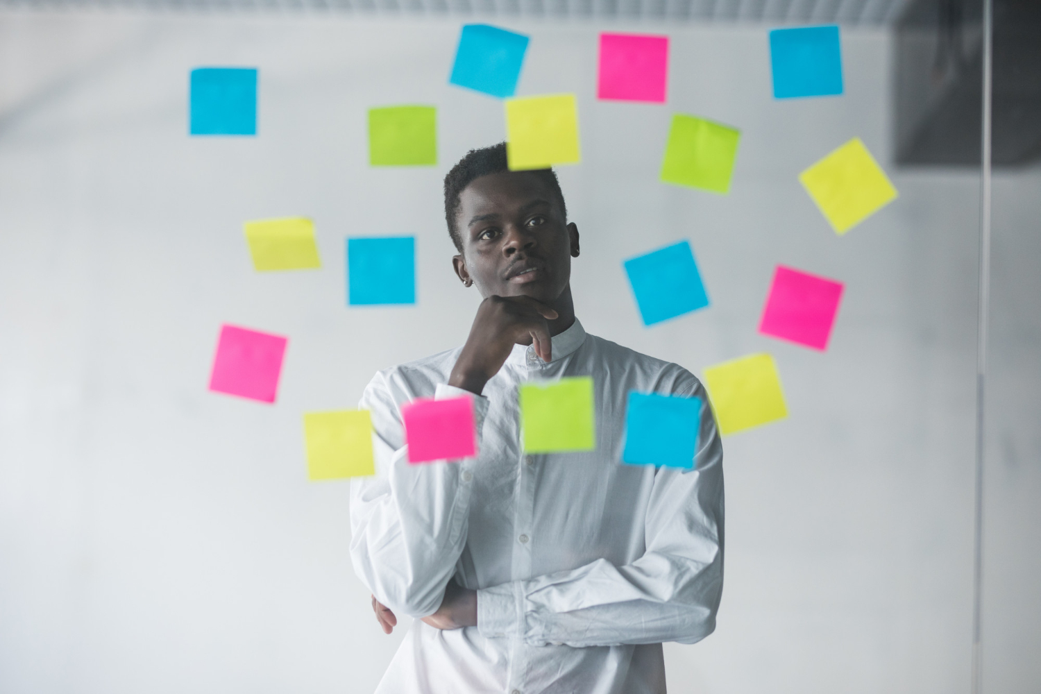 A-person-planning-and-using-sticky-notes-on-his-wall