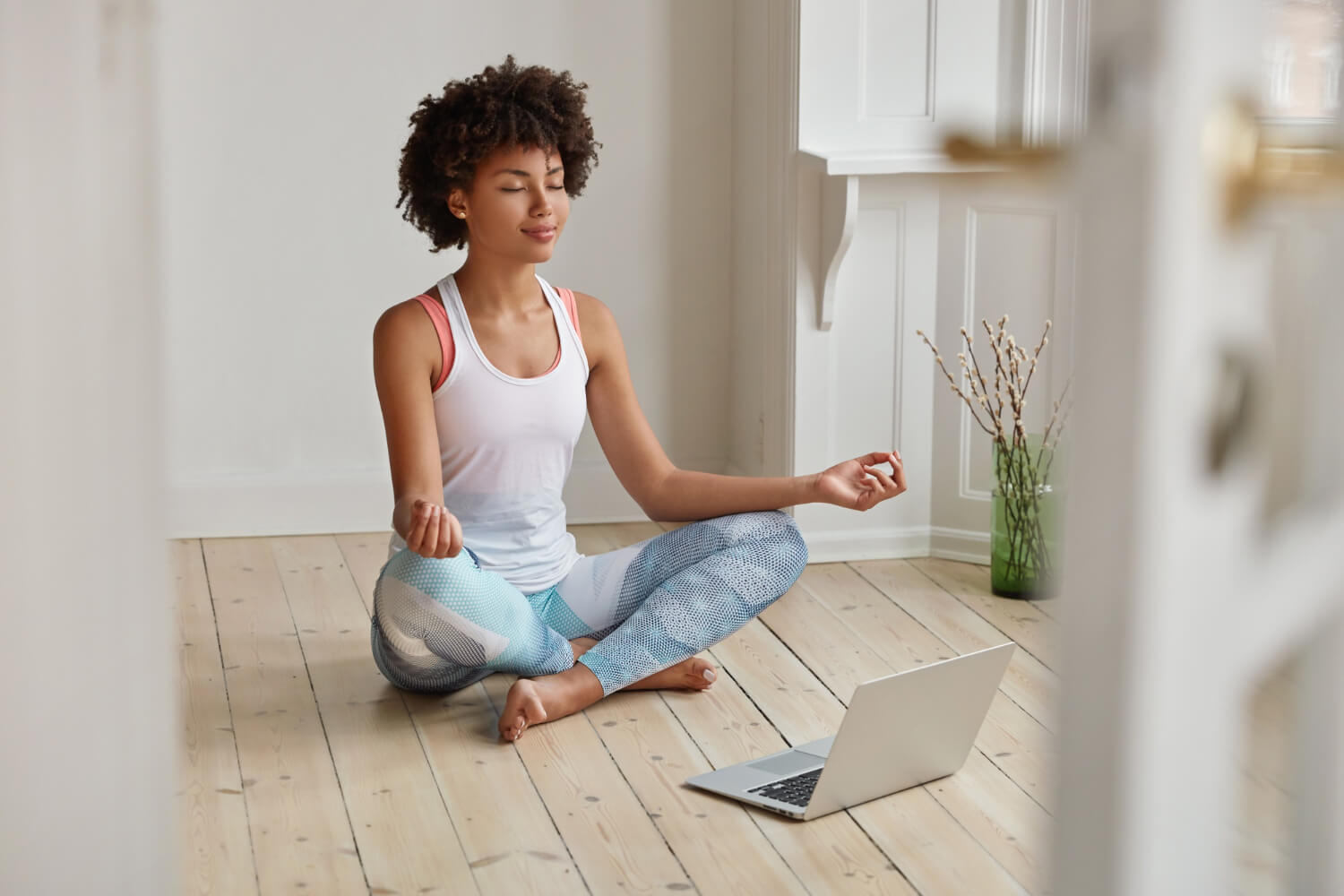 A-young-woman-relaxed-and-meditating-in-her-room.