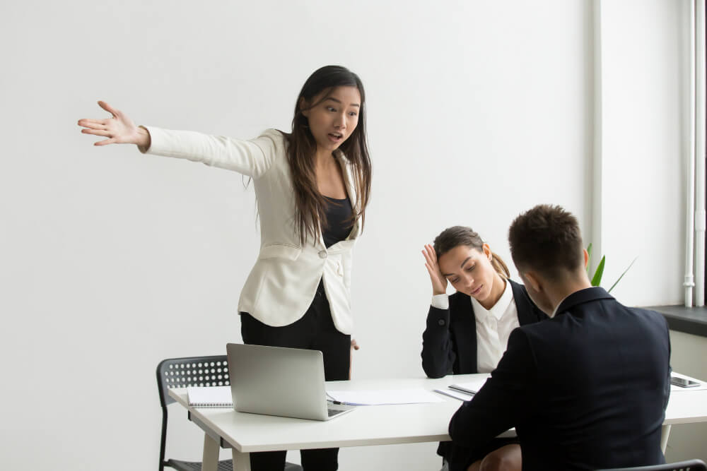 Mad HR representative pointing at door asking an interviewee to leave