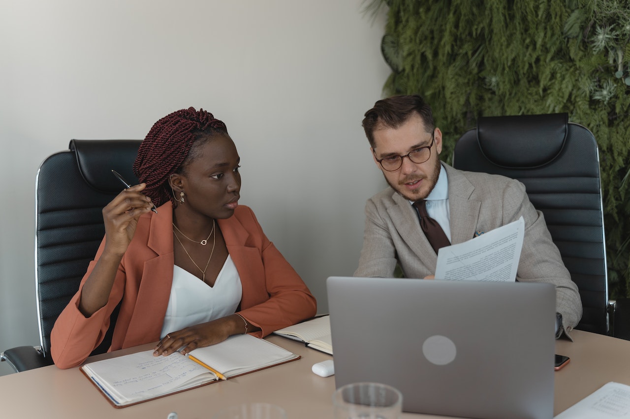 Business people going through a document while seated