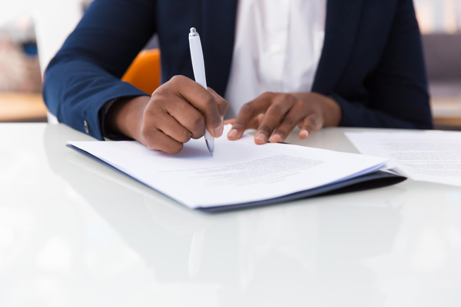 Young woman signing a contract