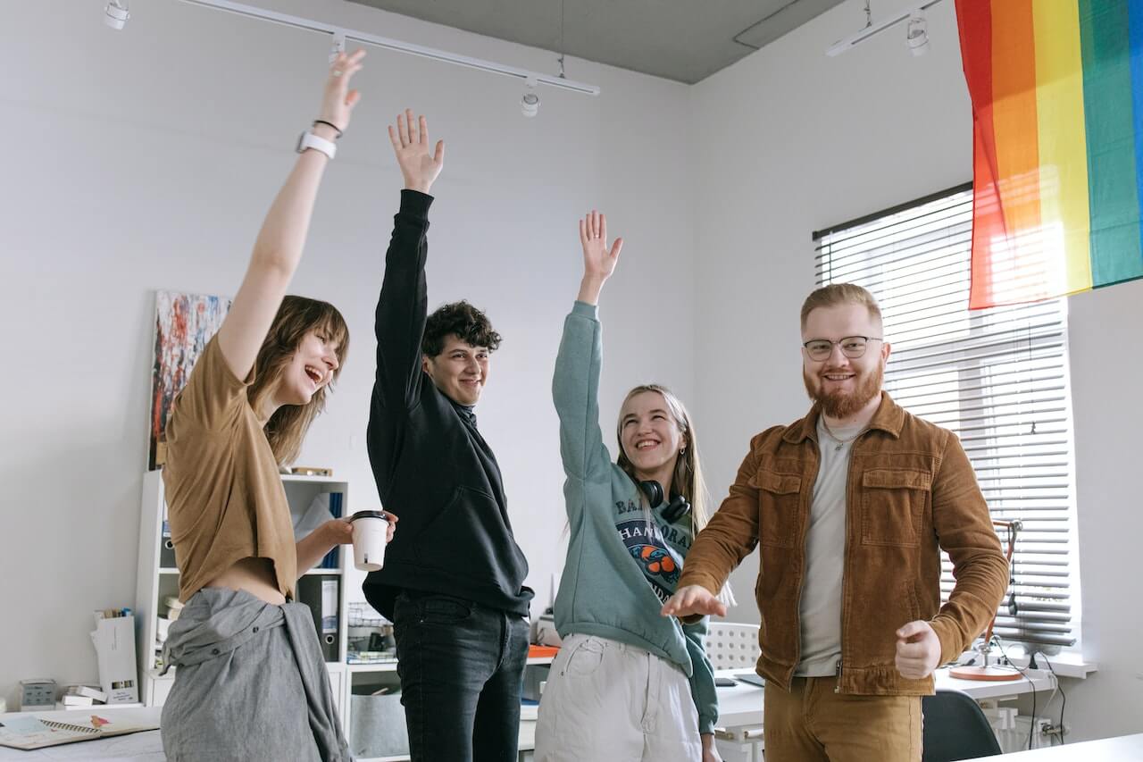 Group of People Raising Their Hands