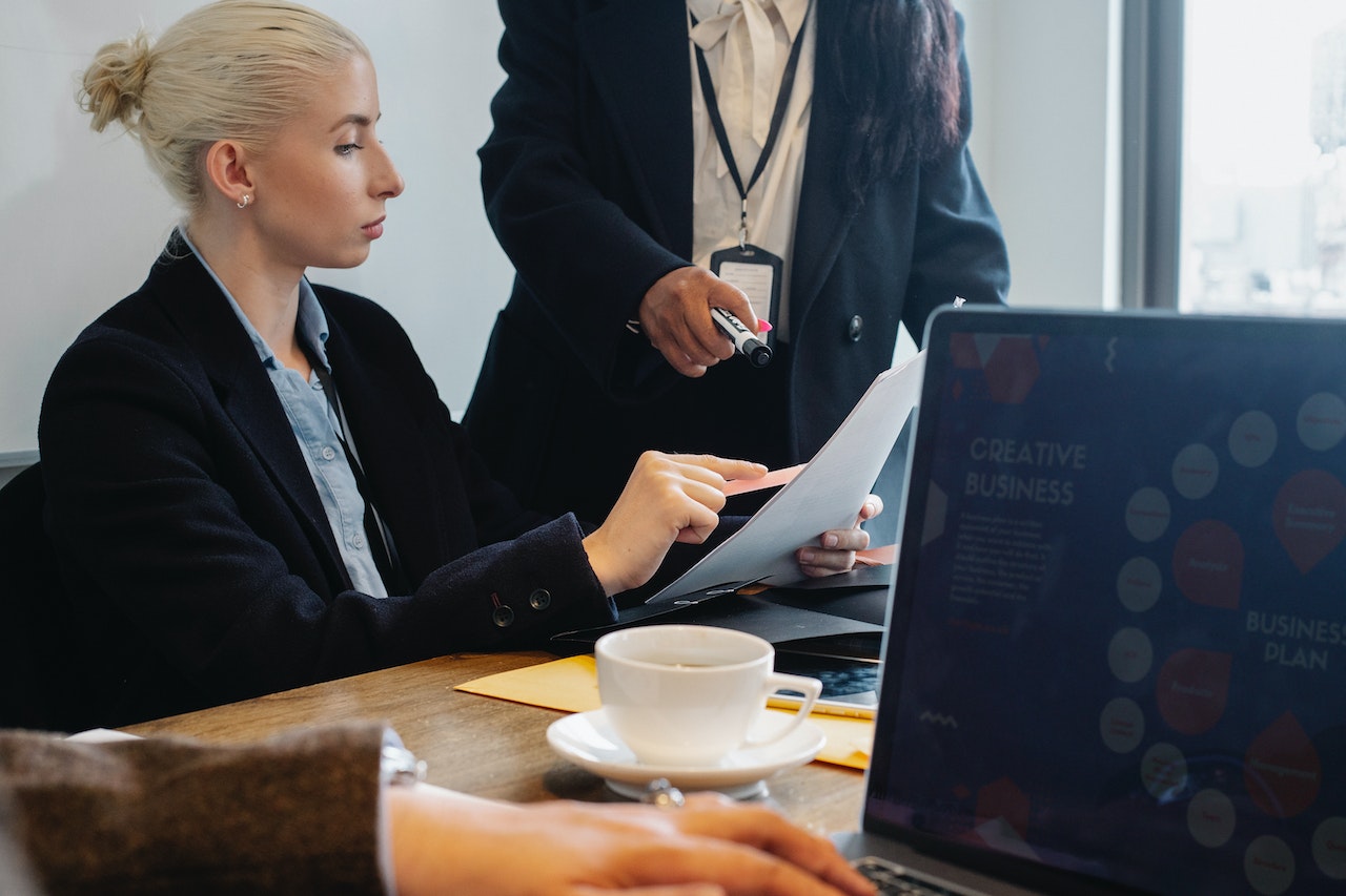 Group of colleagues going through a document