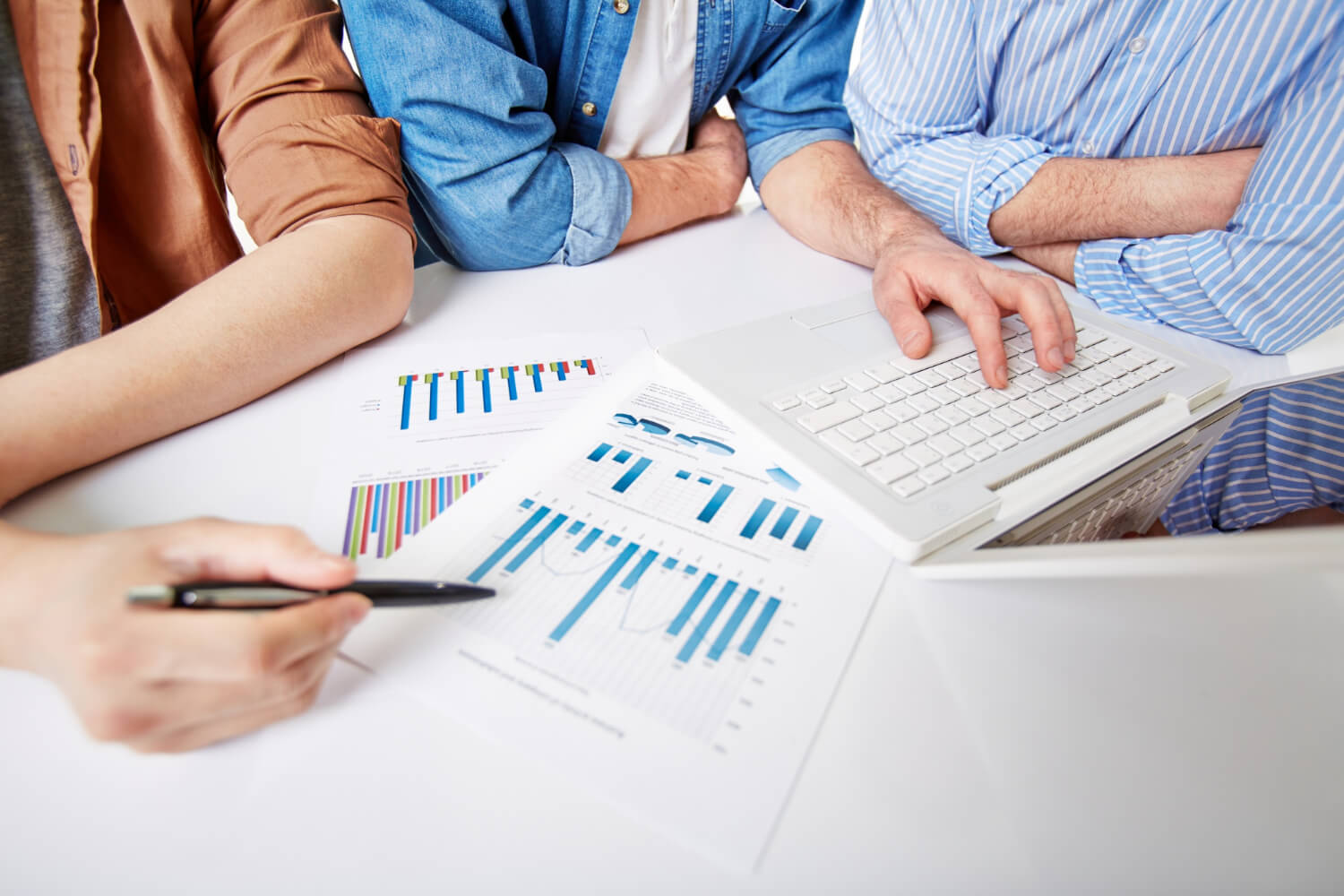 Close-up of man pointing to a chart