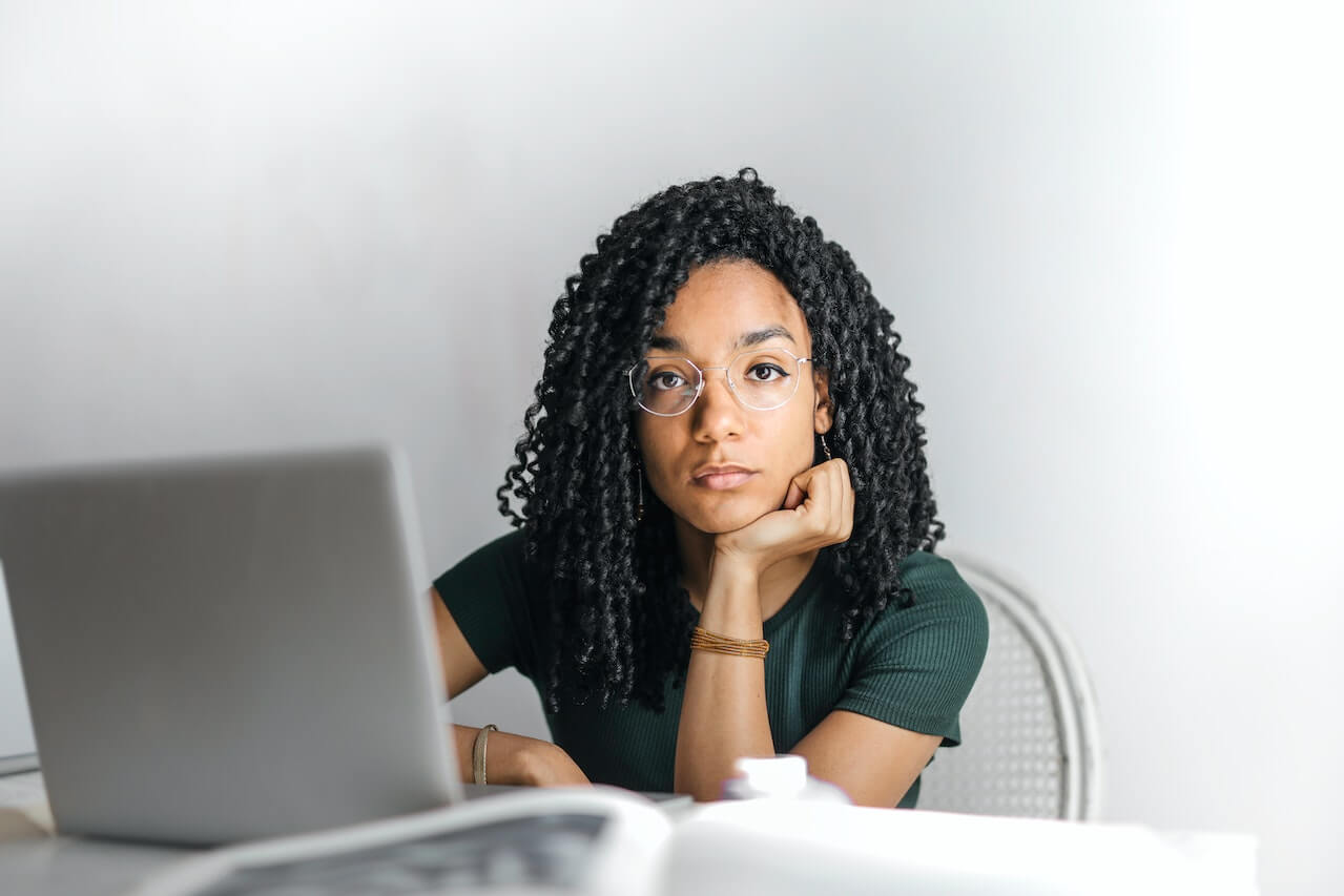 Serious young woman using a laptop