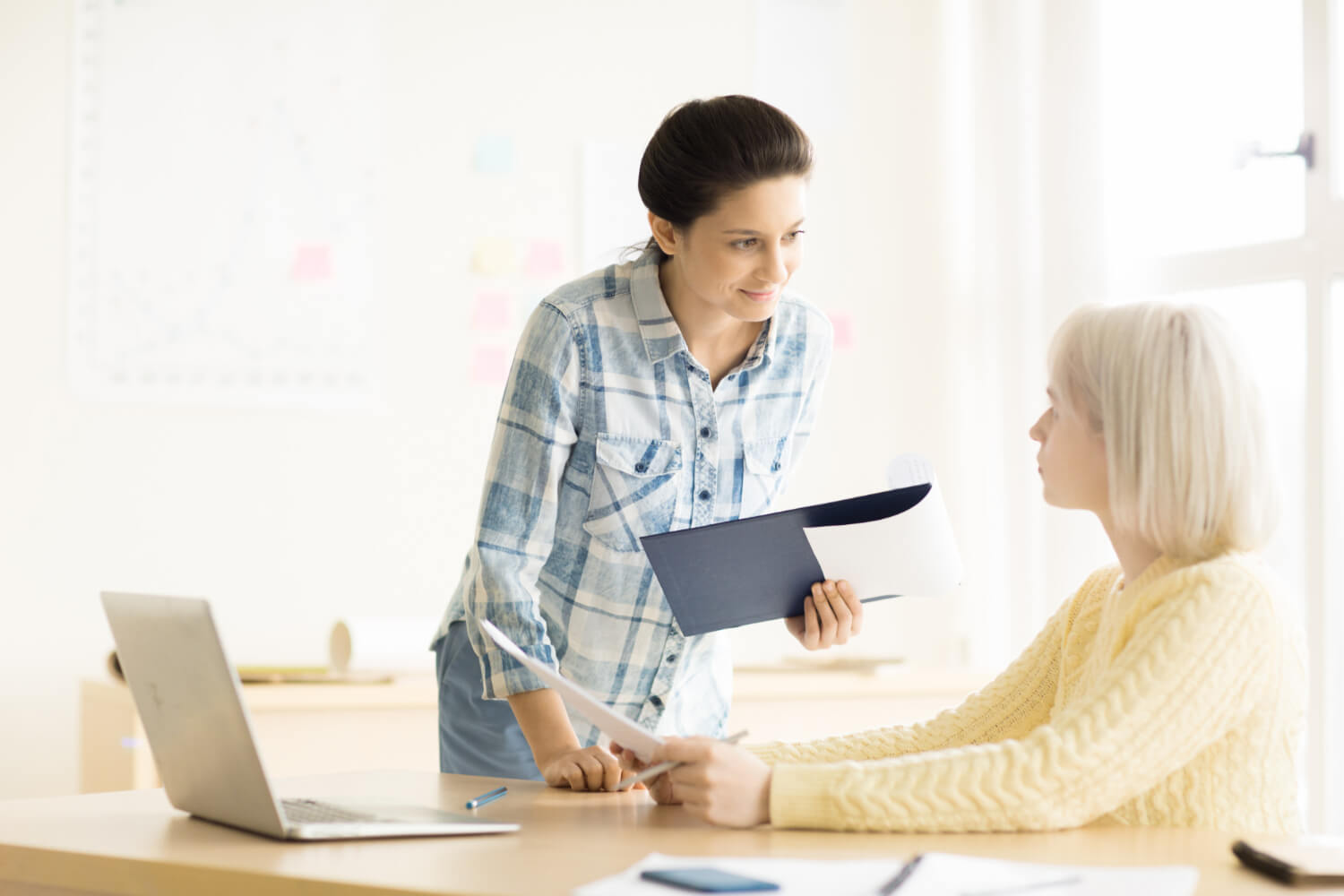 Women working in office together