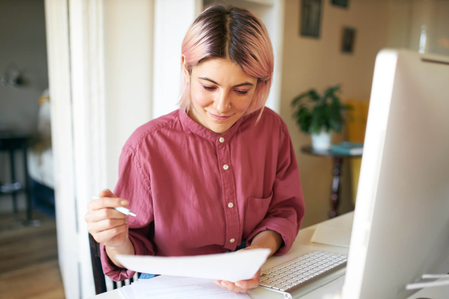 Young-female smiling looking at a document