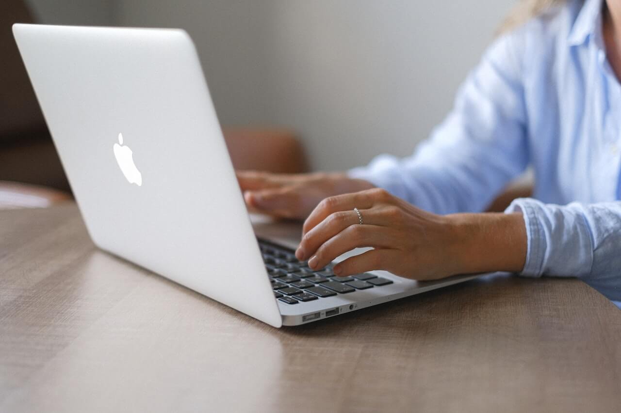 Young lady surfing the internet on her laptop