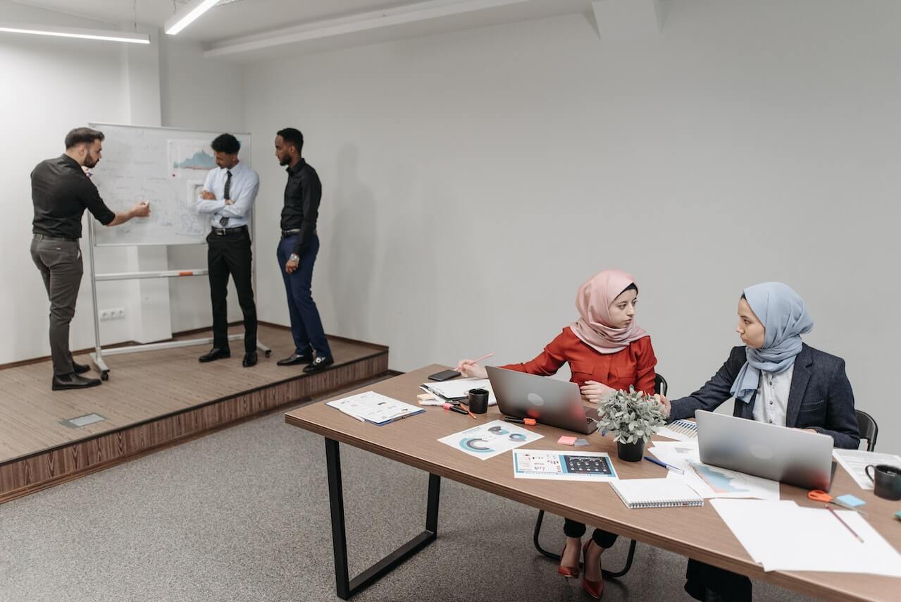 a-group-of-employees-discussing-office-matters-in-a-meeting