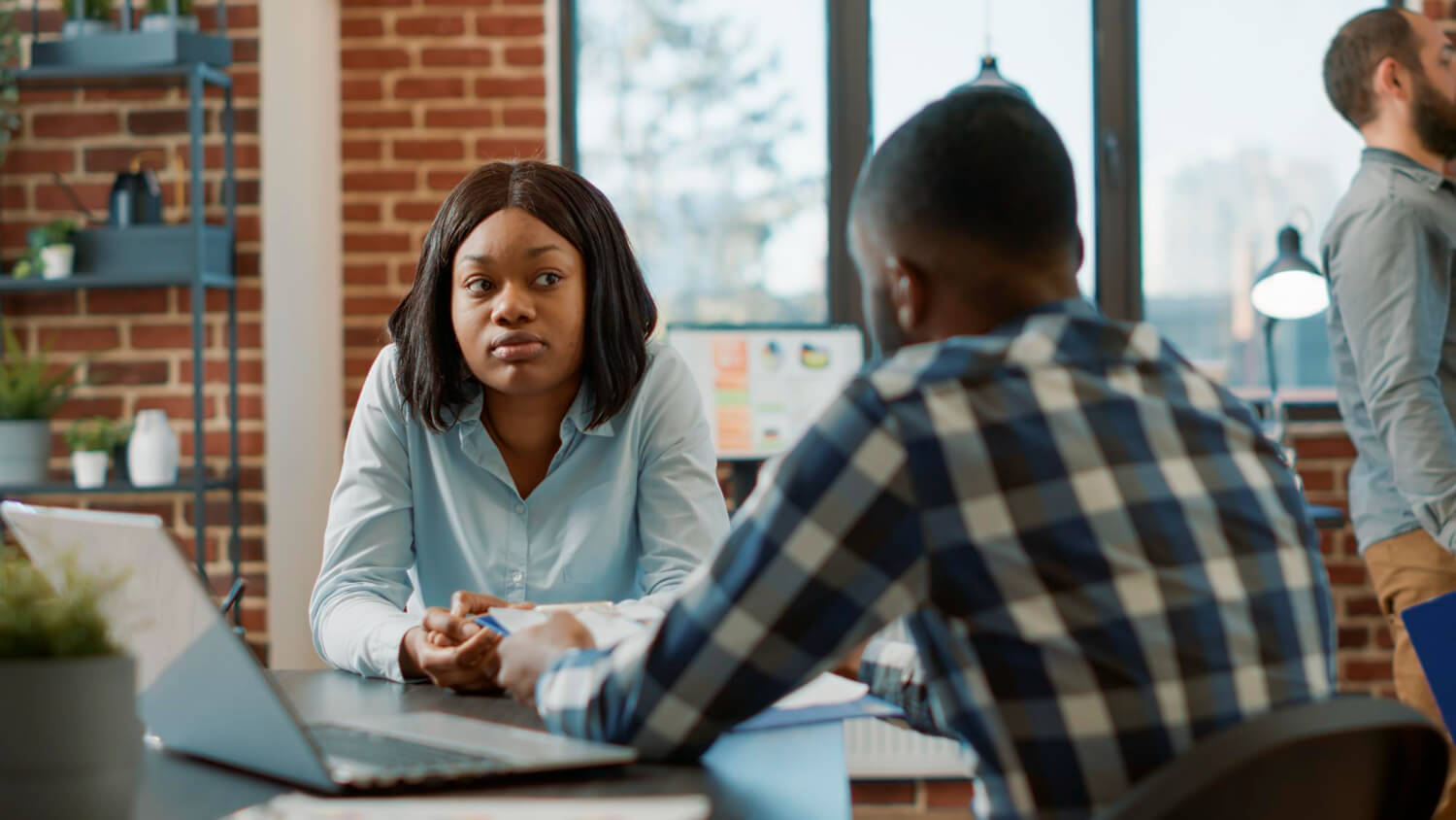 office-worker-interviewing-female-candidate-about-job-offer