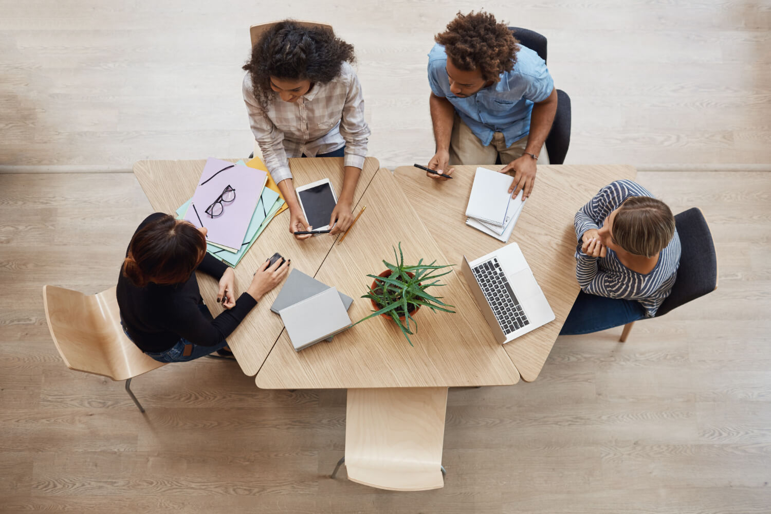 professional-entrepreneurs-sitting-round-a-table-making-business-plans.