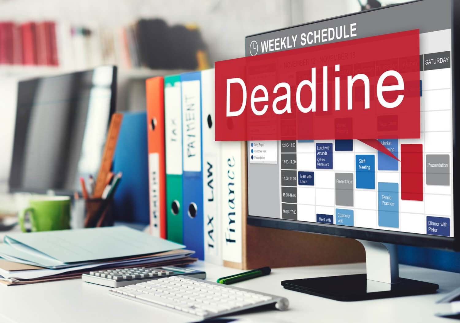 The word "deadline" written boldly on an office calendar