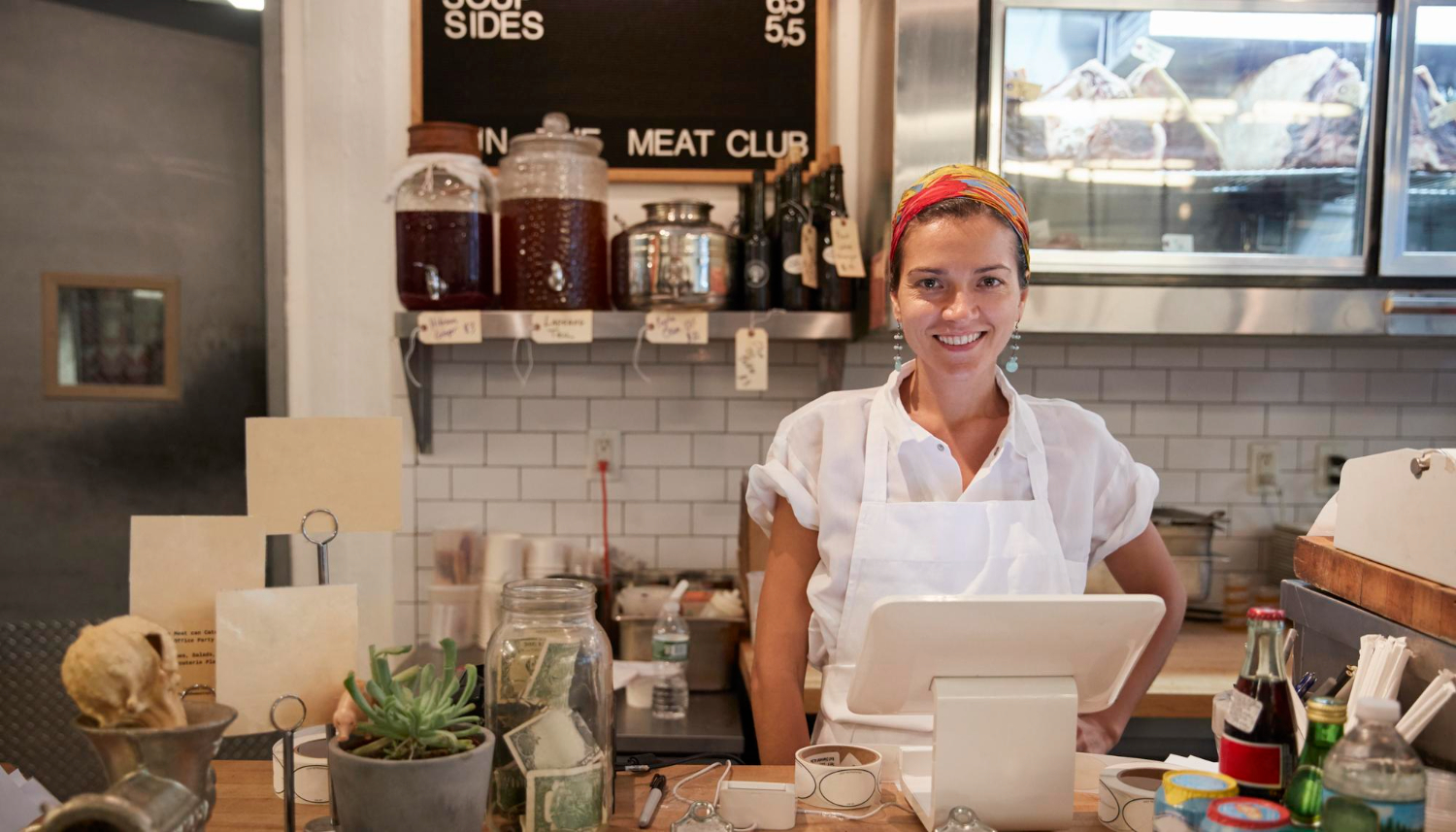 Small business owner in Kentucky behind a counter