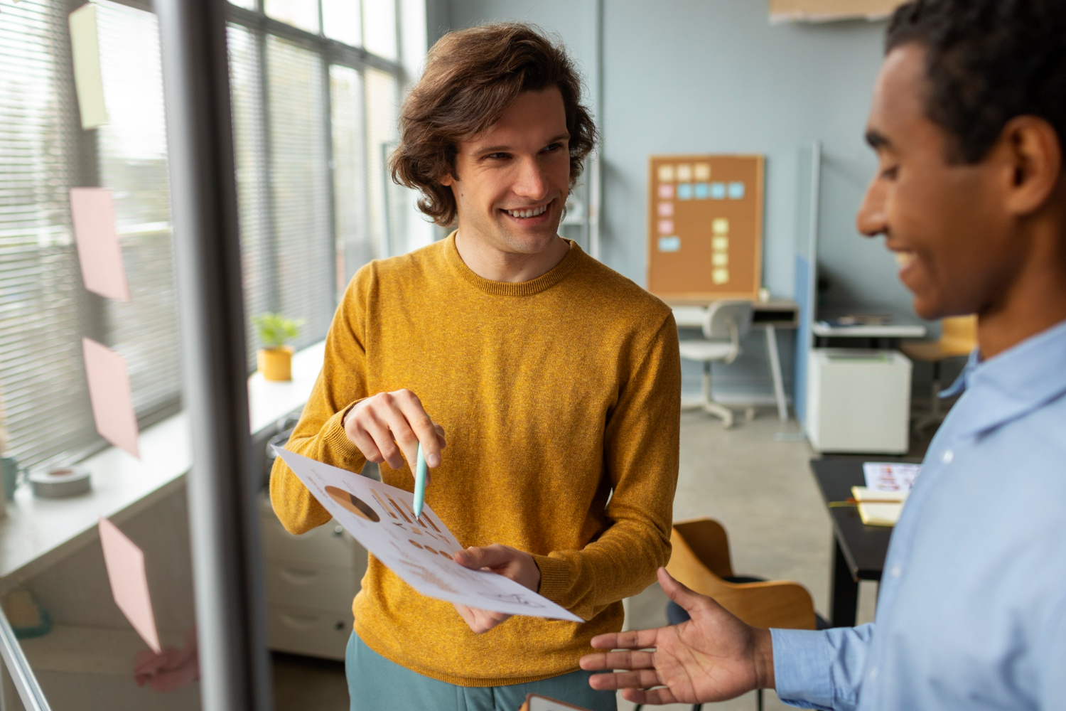 Two people discussing finances in an office