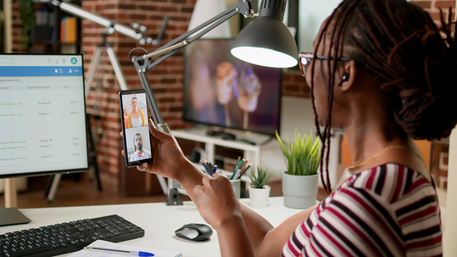 A solopreneur taking a webinar class at their workspace