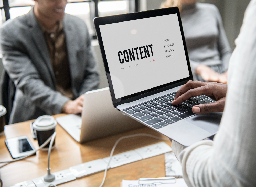 Someone holding a laptop whose screen is displaying a content concept