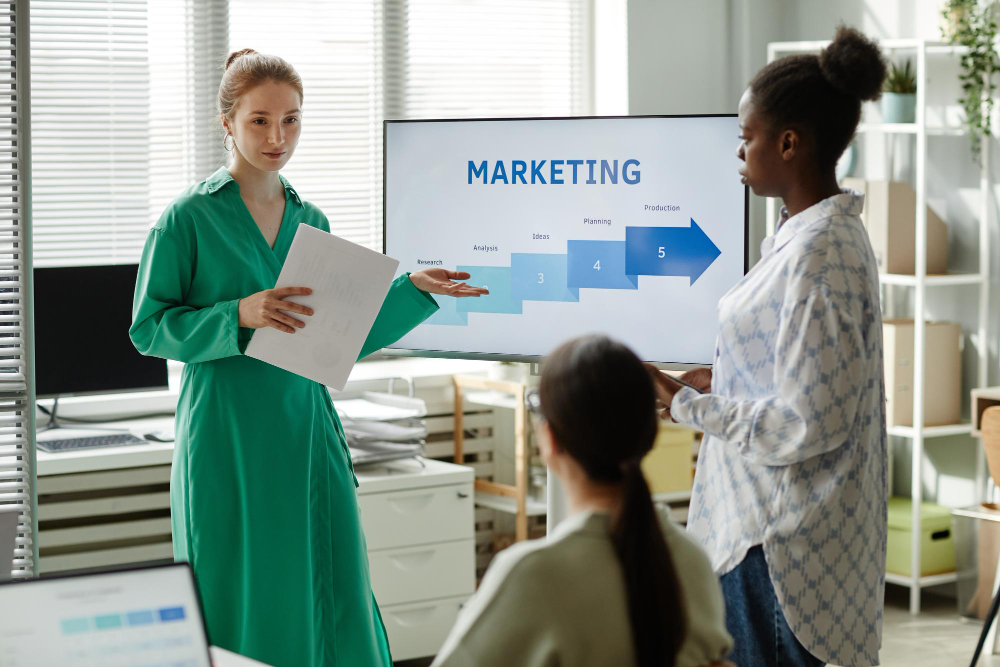 Woman giving a marketing presentation to colleagues